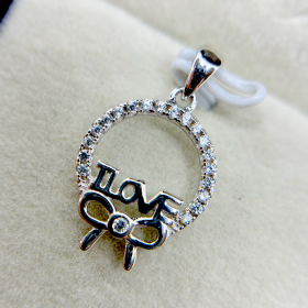 A silver pendant with the word "LOVE" and an infinity symbol, adorned with small diamonds