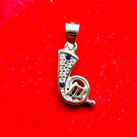 A silver musical note pendant with embedded diamonds