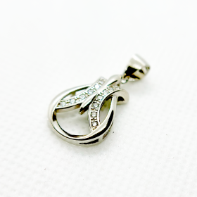 A silver pendant in the shape of an abstract design with embedded diamonds