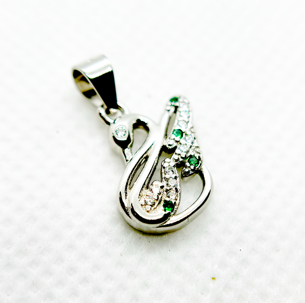 " Silver and green gemstone pendant in the shape of an abstract figure"