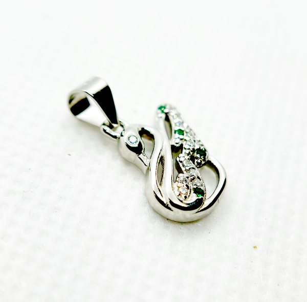 " Silver and green gemstone pendant in the shape of an abstract figure"