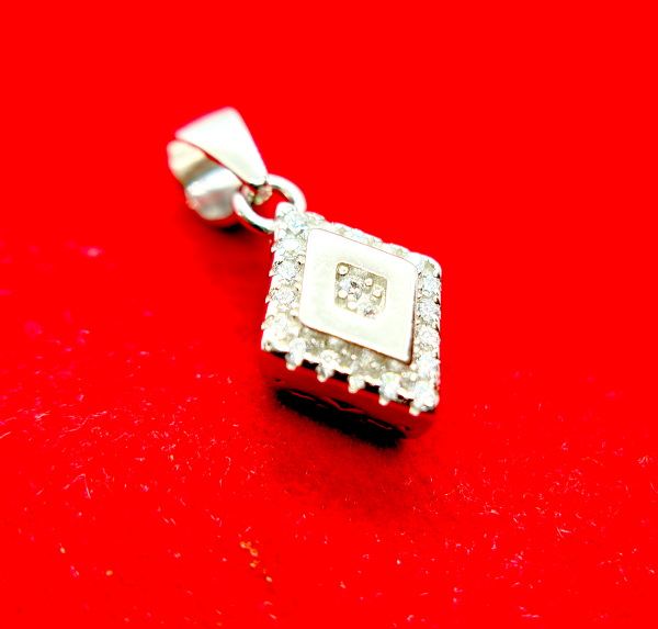 A square-shaped pendant with a concentric diamond design, surrounded by smaller diamonds