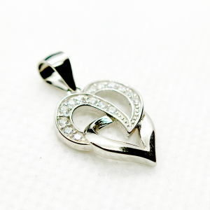 A silver heart-shaped pendant with an intertwined design and small diamond