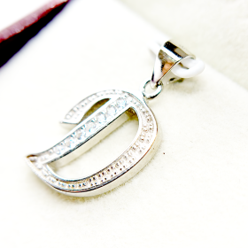 Silver letter D pendant with embedded diamonds