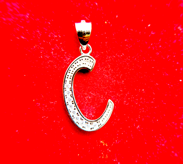 Silver letter C pendant with embedded diamonds