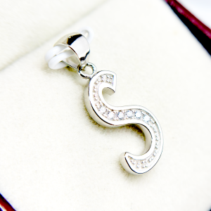 Silver letter S pendant with embedded diamonds