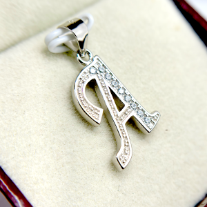 Silver letter A pendant with embedded diamonds